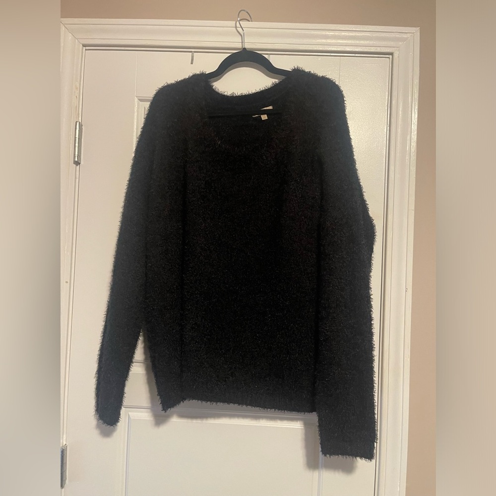 Textured black sweater.
